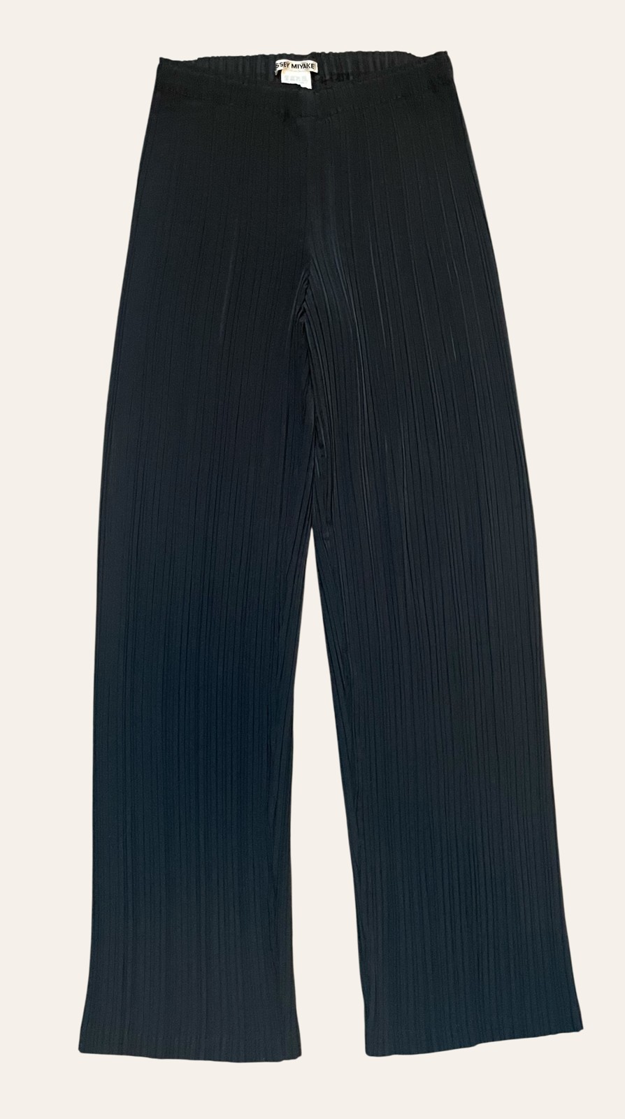 A pair of navy wide-leg trousers photographed flat