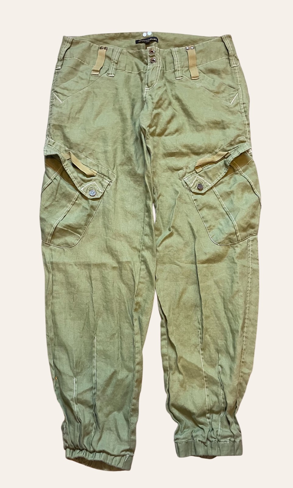 A pair of vintage olive workwear-style trousers photographed flat
