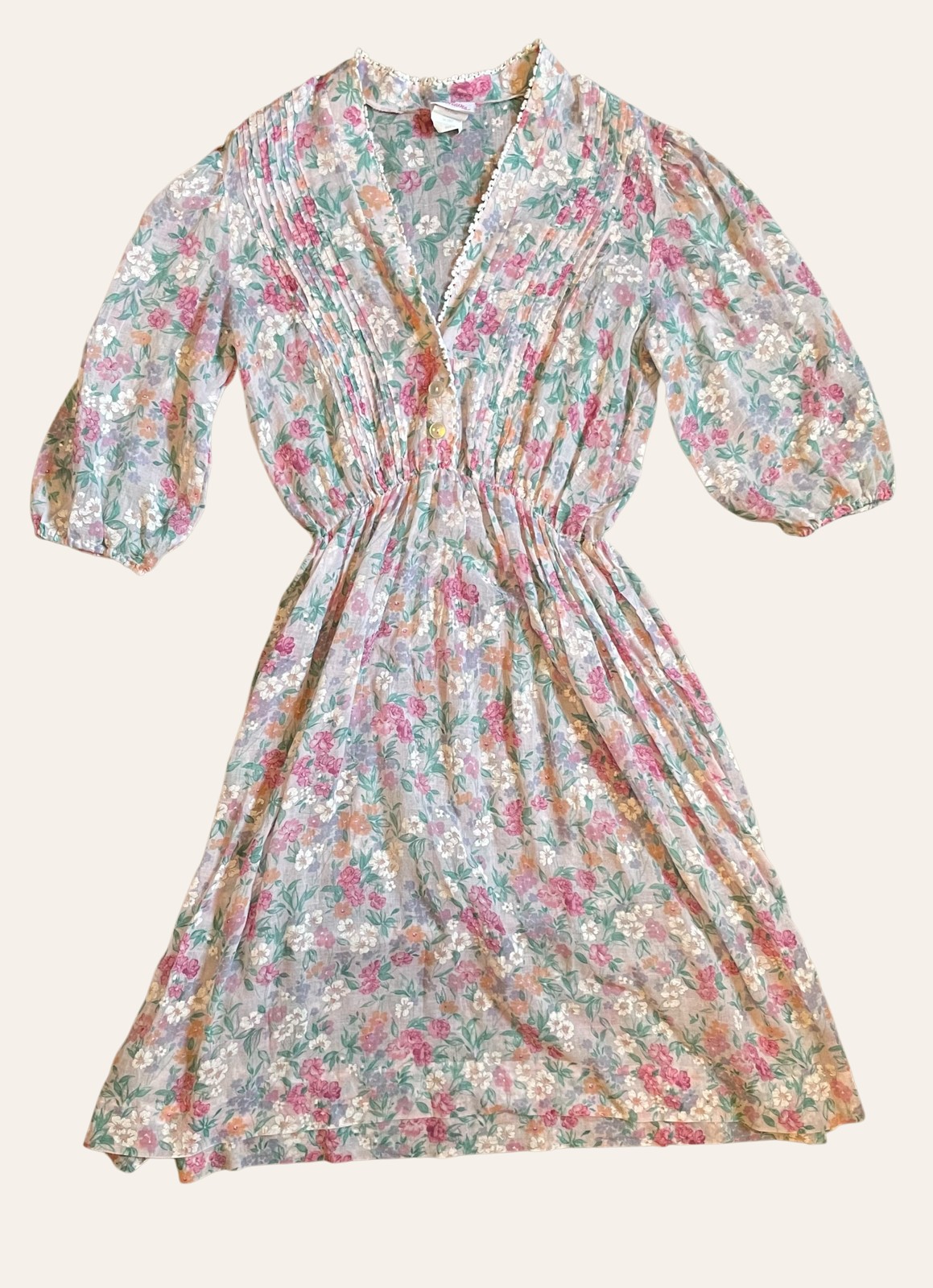 A patterned vintage dress photographed flat