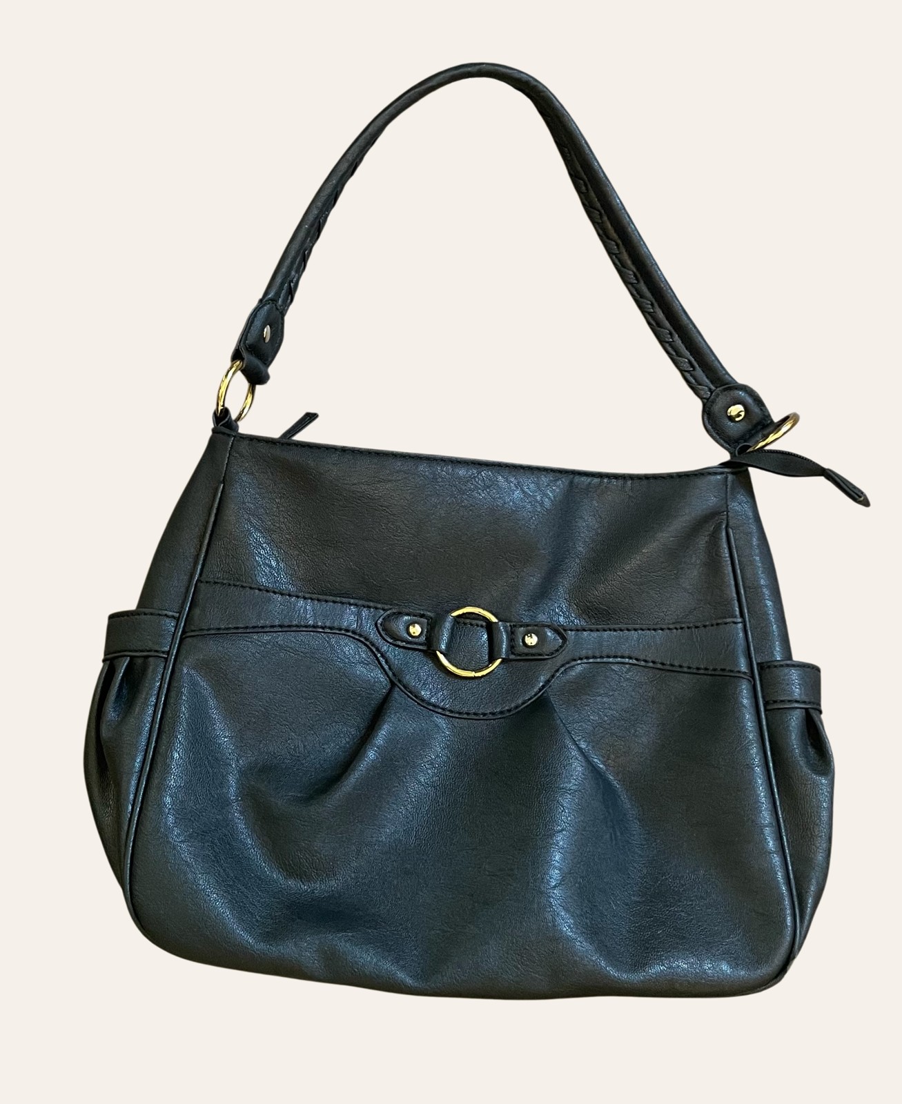A structured vintage leather shoulder bag photographed flat